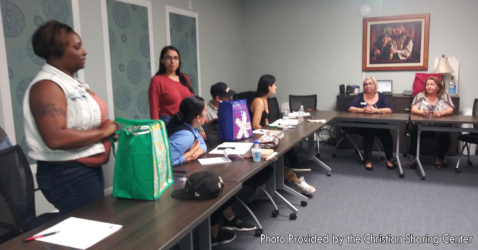 Taken by Teresa Engle, a LifeBuilder case manager, families gather around to learn about financial literacy. Here in this class, instructors are teaching all about money and how to handle it correctly. With this knowledge, families will be able to spend their money wisely and not lose it to bad habits.