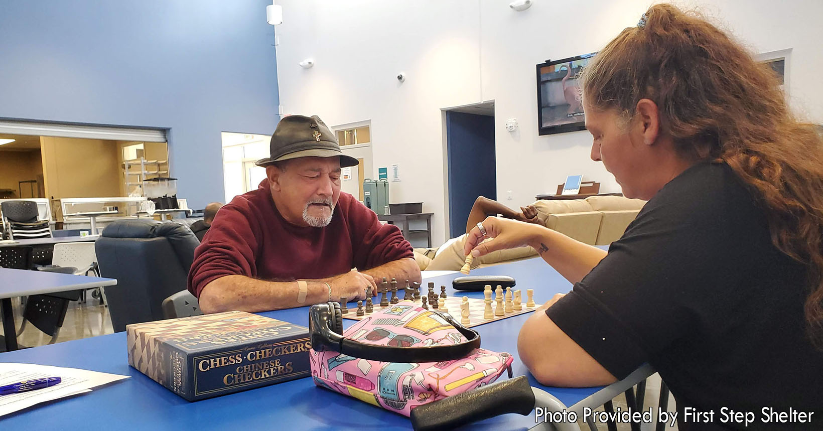 Two of the residents here at the First Step Shelter are playing against each other in a game of chess. At the shelter, many of the residents have lost a lot of their social skills when it comes to being around other people. The games that they can play help them regain their skills to be able to survive in the world.