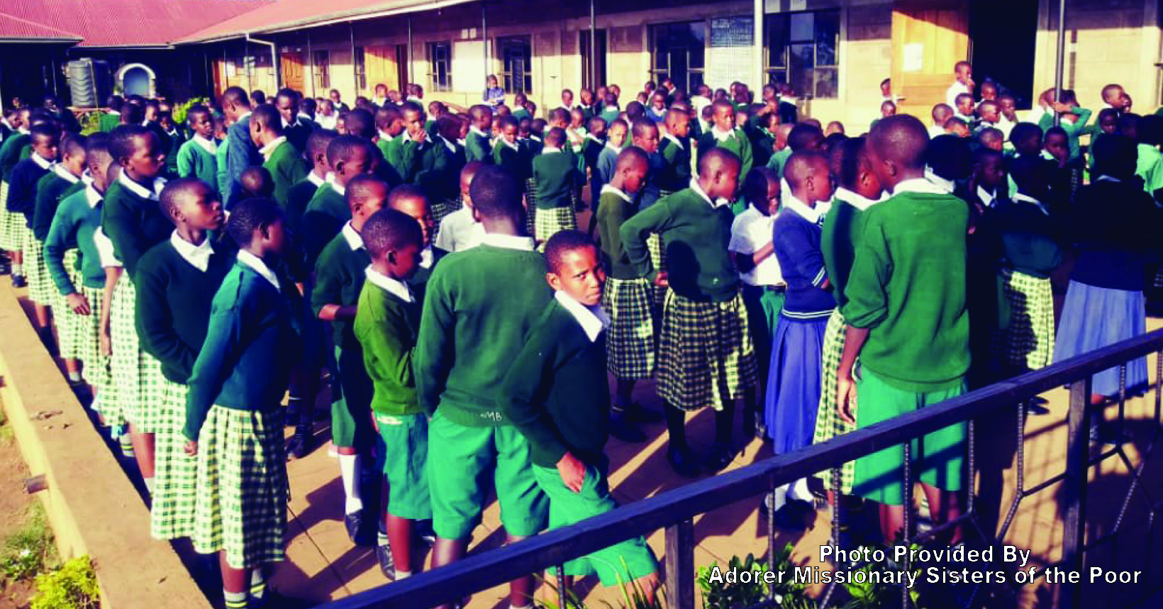 Students are standing in their parade before entering the classroom to begin their classes.