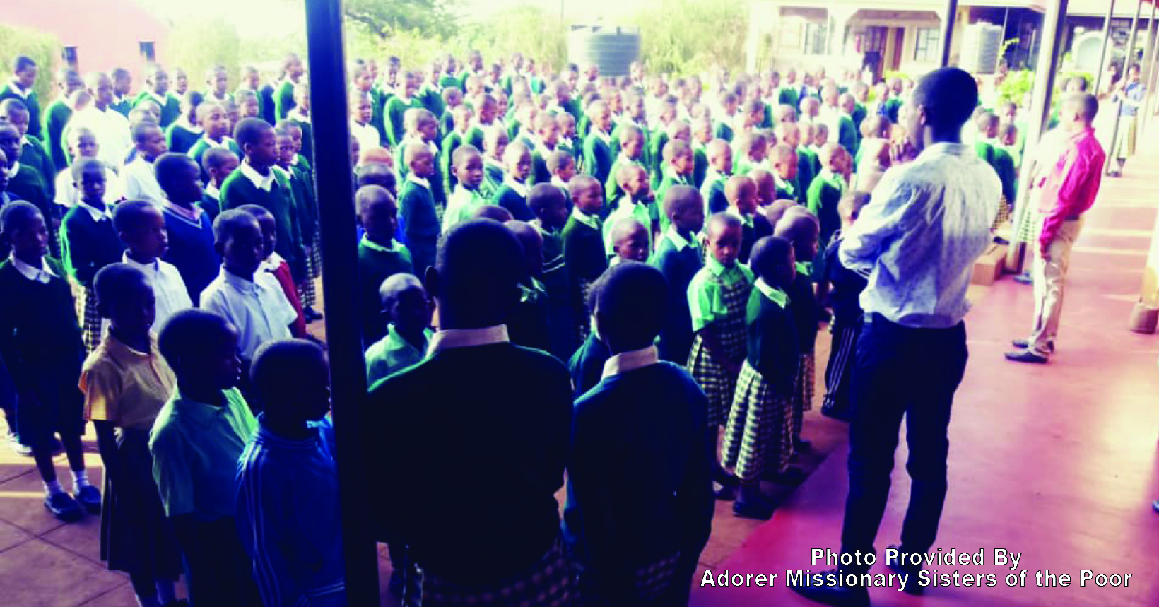 Students are standing in their parade before entering the classroom to begin their classes.