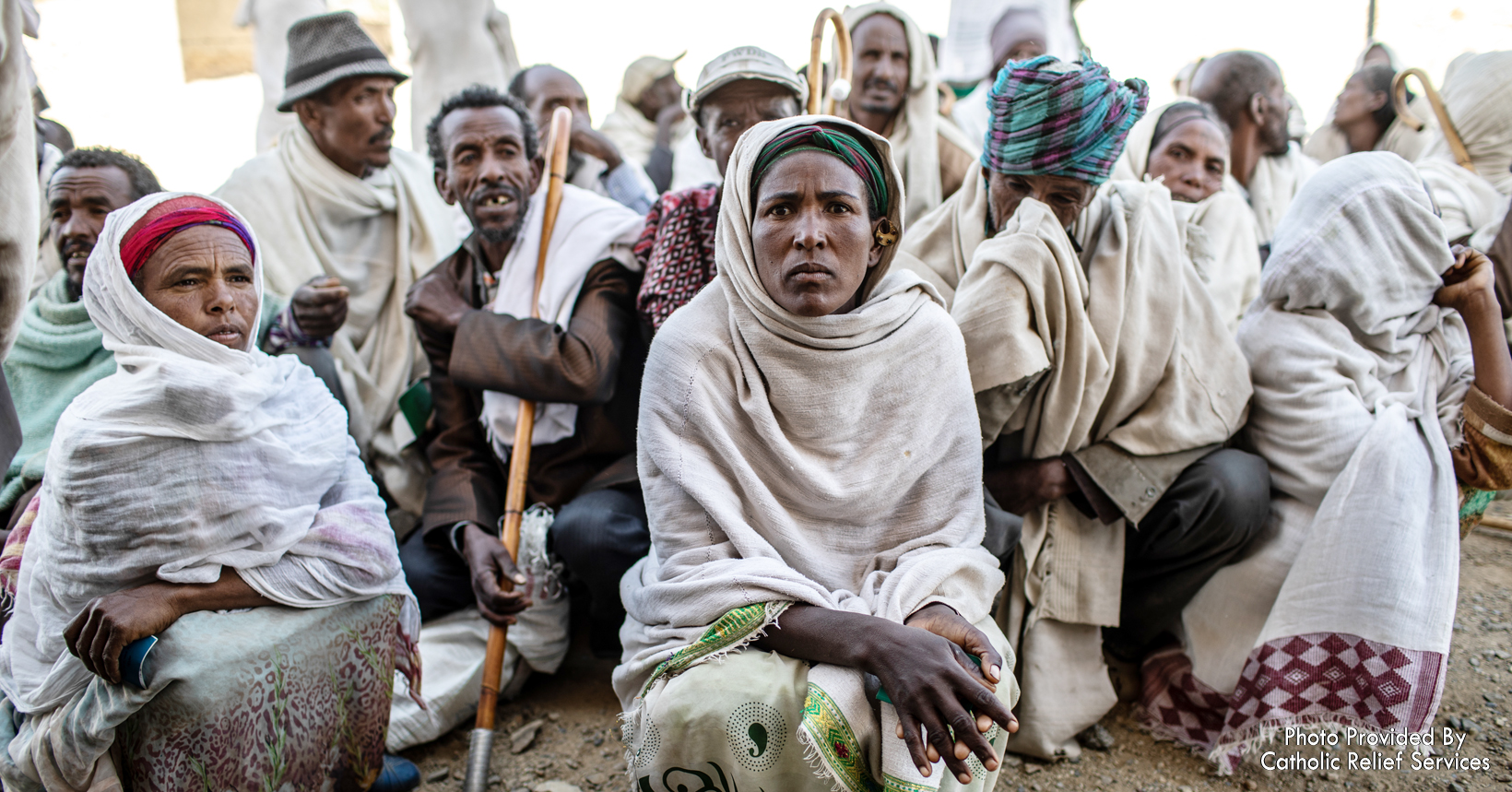 Beneficiaries are gathered around waiting for their turn to register for aid in Tigray Region. The CRS with the United States Agency for International Development to provide wheat, yellow split peas and cooking oil.