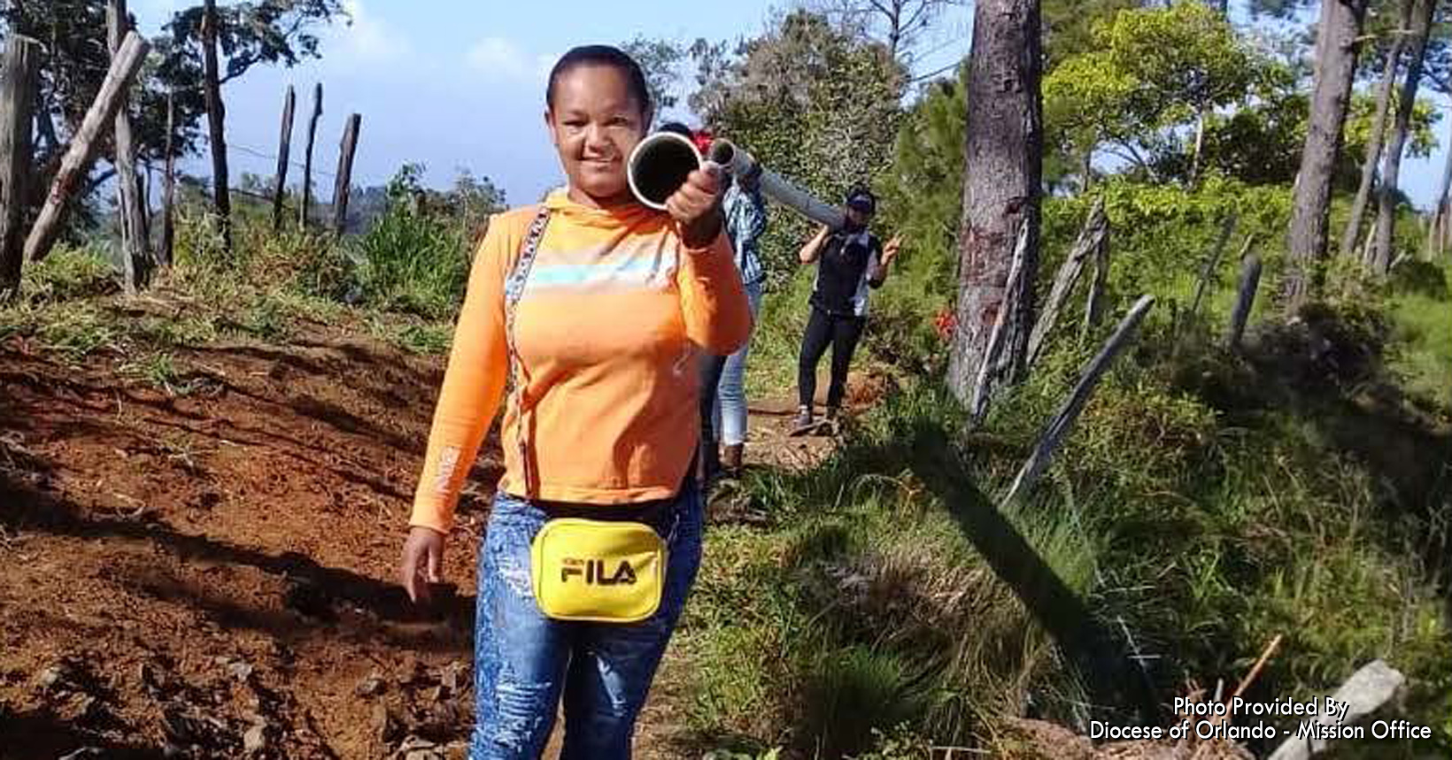 Desideri is one of the many women who are helping the community bring pipes up the mountain.