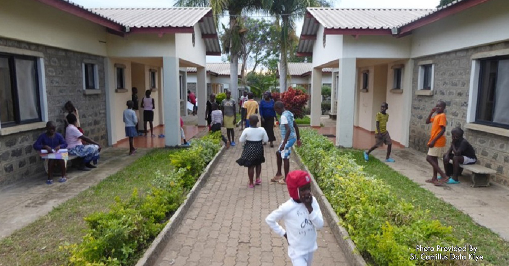 Foster children in front of their foster homes.