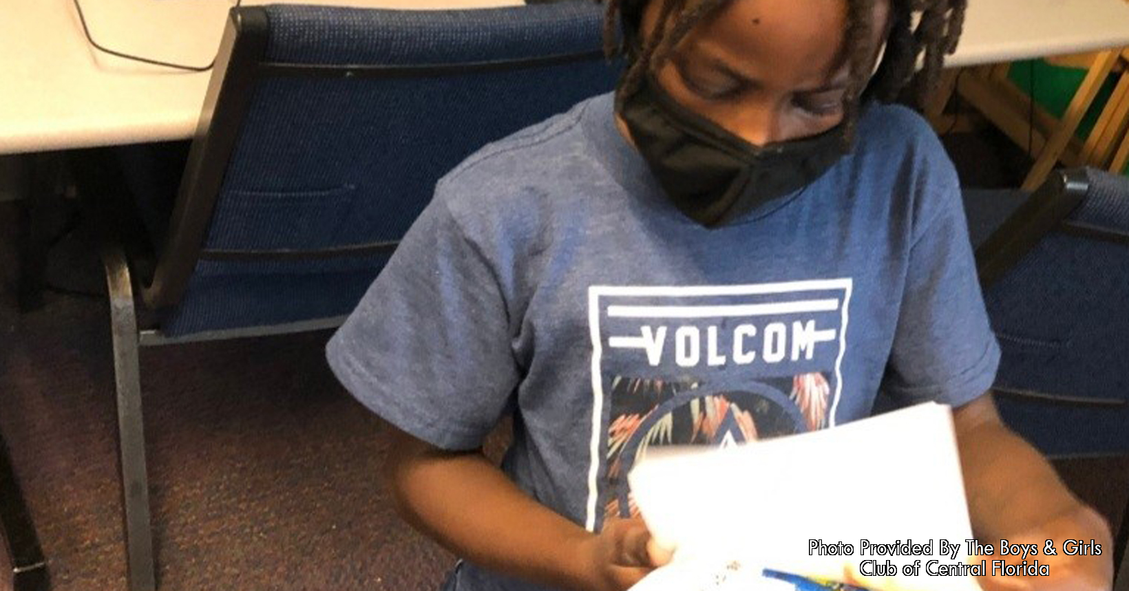 A child reads from their book.