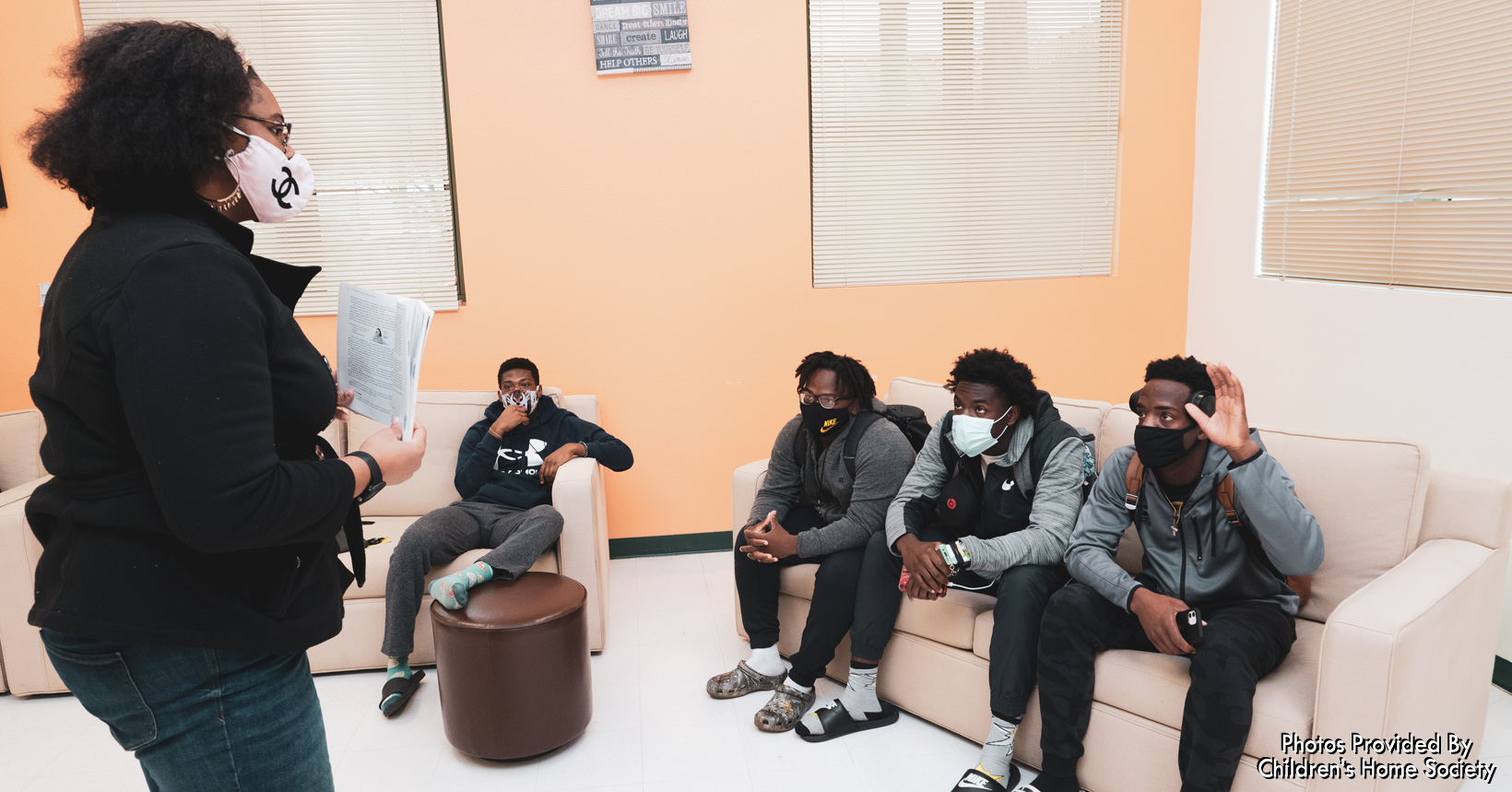 Small group male mentoring session after school at Jones High, a Community Partnership School.