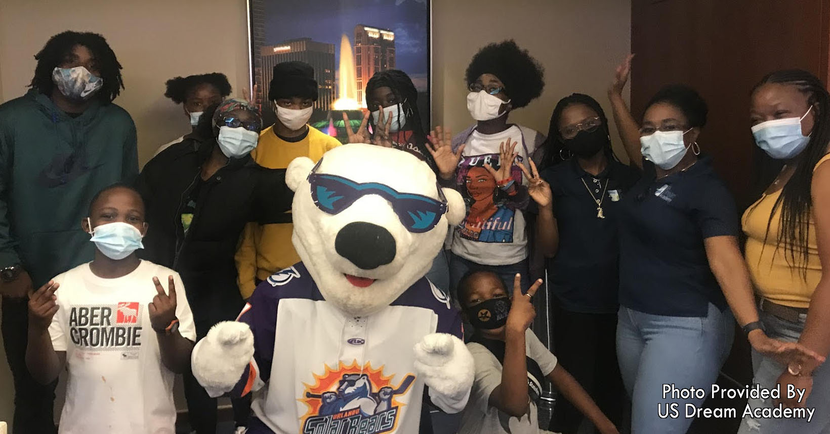 Group photo with Solar Bear Mascot.